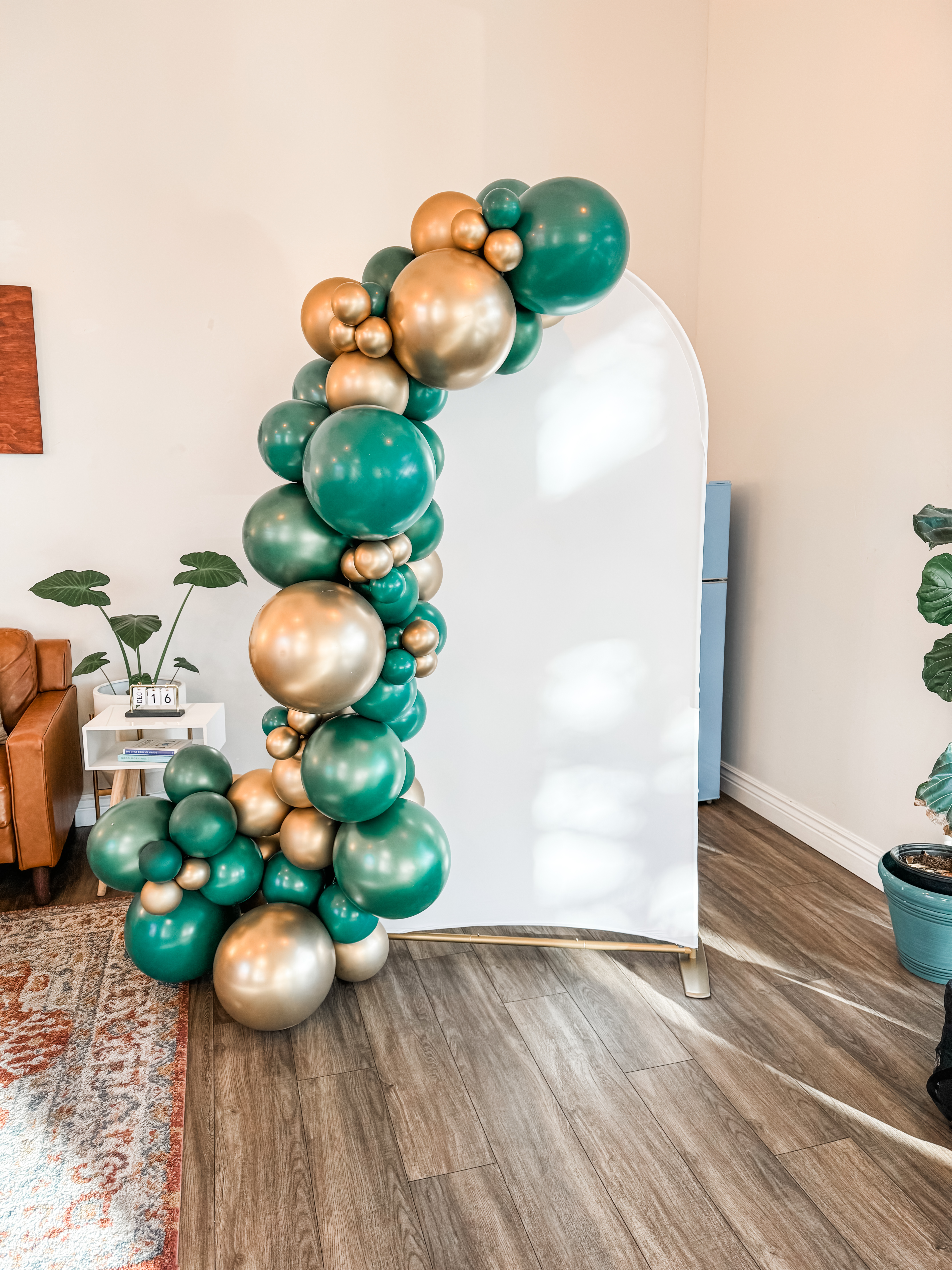 Green and gold balloon photo backdrop by Poptastic Parties, Pleasanton
